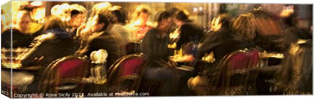 Customers sat outside a Parisien cafe in the evening eating and drinking. Canvas Print by Rose Sicily
