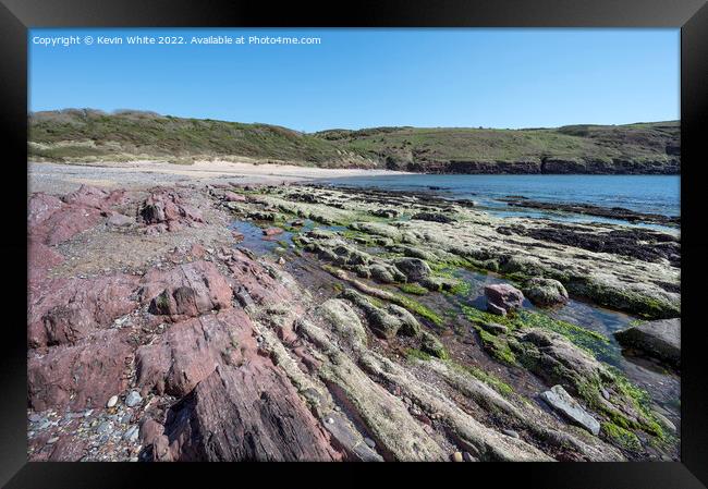 Differenent coloured rocks on Manorbier Beach Pembrokeshire Framed Print by Kevin White