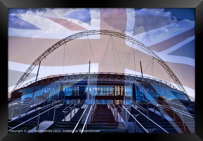 Wembley Stadium with faded Union Jack Framed Print by Ann Biddlecombe