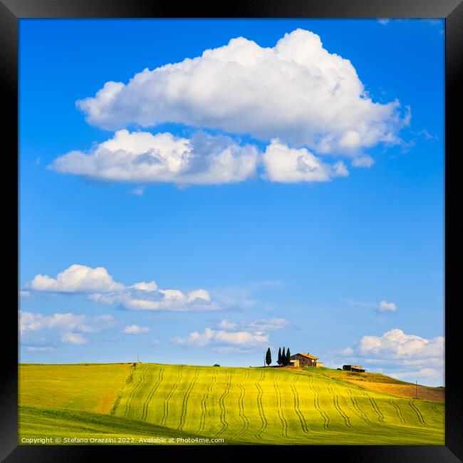 Tuscany, farm on the top of the hill and a cloud. Pienza, Italy Framed Print by Stefano Orazzini