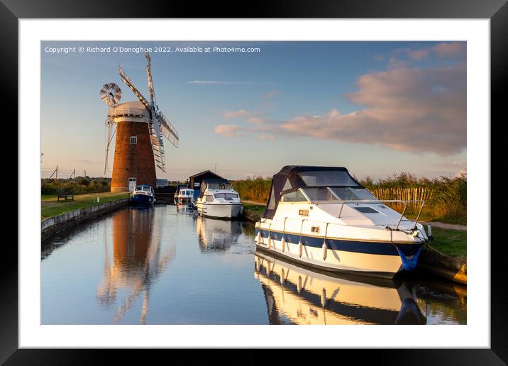 Boats moored at Horsey Mill on the Norfolk Broads at sunrise Framed Mounted Print by Richard O'Donoghue