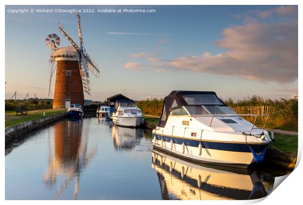 Boats moored at Horsey Mill on the Norfolk Broads at sunrise Print by Richard O'Donoghue