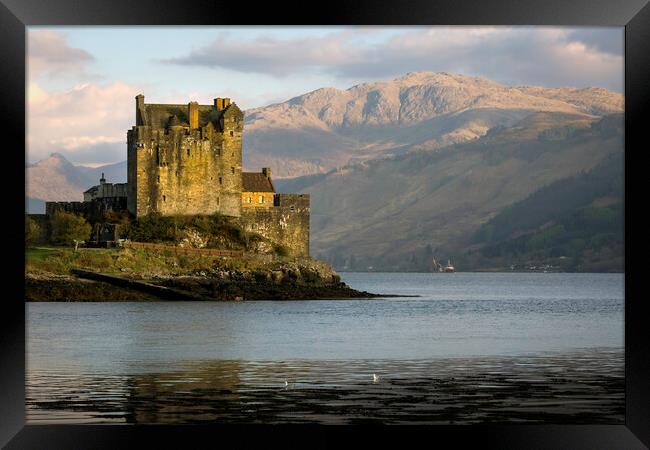 Eilean Donan Castle and mountains Framed Print by Leighton Collins