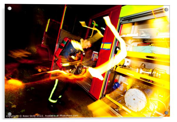 Firefighter in breathing apparatus and fire appliance with blurred lights at a fire Acrylic by Rose Sicily
