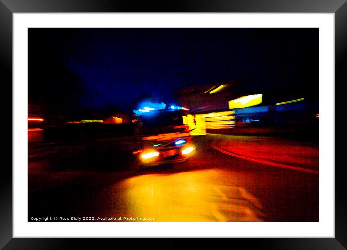 Fire engine leaving fire station on an emergency call Framed Mounted Print by Rose Sicily