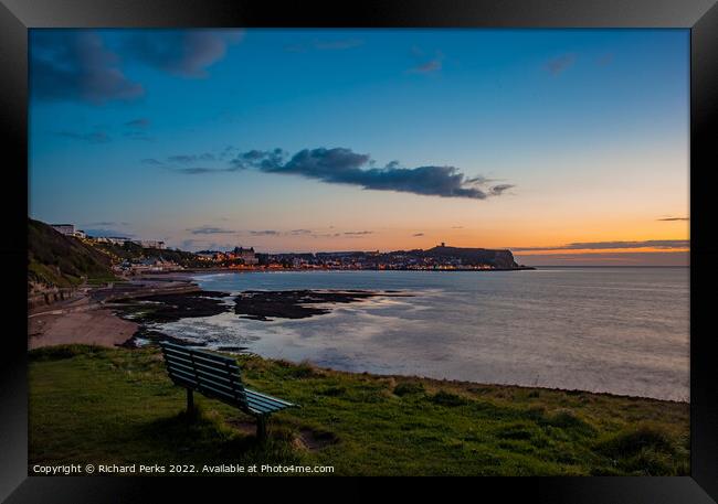 Watching the sunrise over Scarborough Framed Print by Richard Perks