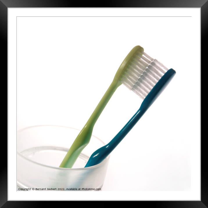 Two toothbrushs Framed Mounted Print by Bernard Jaubert