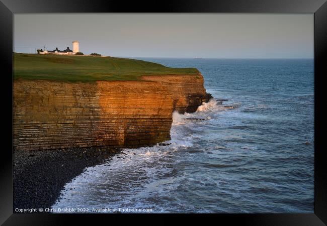 Nash Point and Lighthouse at sunset Framed Print by Chris Drabble