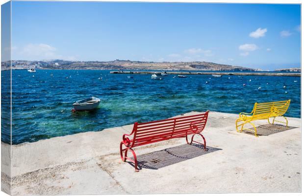Red and yellow benches face out to sea Canvas Print by Jason Wells