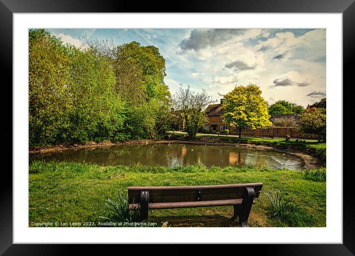 A Seat By The Village Pond Framed Mounted Print by Ian Lewis
