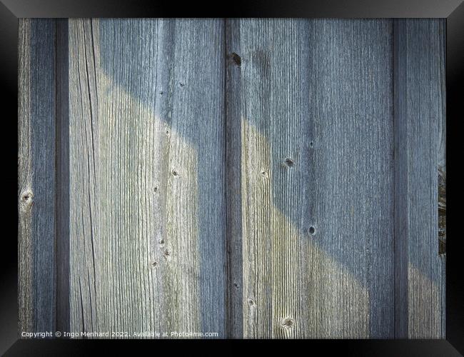 A closeup of a wooden wall background on a sunny day Framed Print by Ingo Menhard