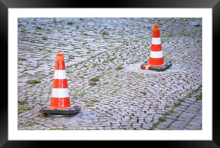 Two orange security road barriers on a street Framed Mounted Print by Ingo Menhard