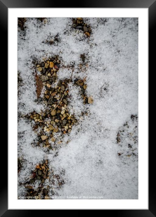 Vertical shot of a ground with small stones covered with the snow Framed Mounted Print by Ingo Menhard