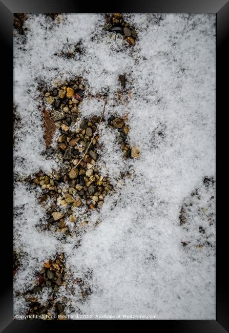 Vertical shot of a ground with small stones covered with the snow Framed Print by Ingo Menhard