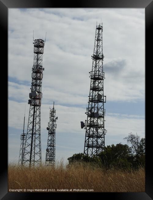 A cloudy day on the communication towers in the field Framed Print by Ingo Menhard