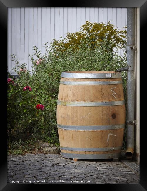 A vertical shot of an old big wooden rain barrel in the garden Framed Print by Ingo Menhard
