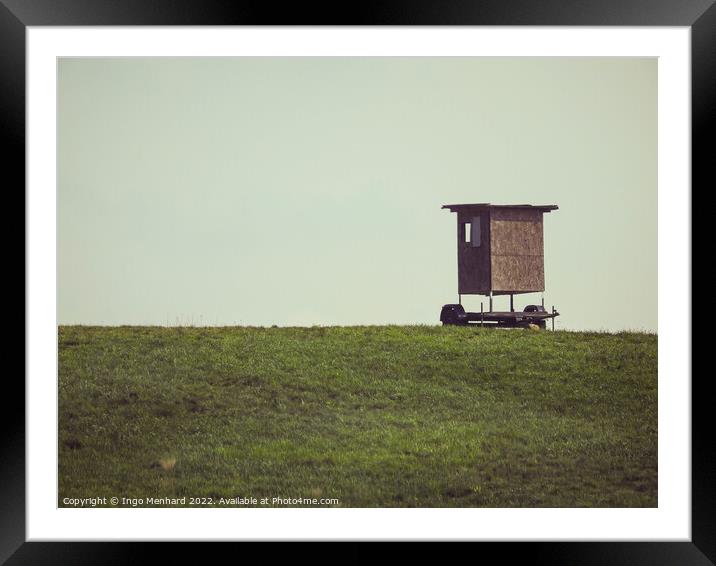 Brown hunter seat on the field Framed Mounted Print by Ingo Menhard