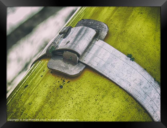 Closeup shot of a metal scratched and wethered rusty clasp Framed Print by Ingo Menhard