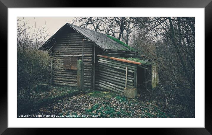 Old and weathered wooden house surrounded by trees in the woods Framed Mounted Print by Ingo Menhard