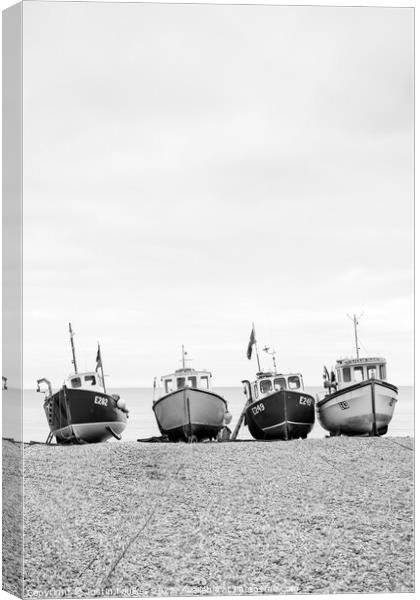 Fishing boats on the beach at Beer, Devon Canvas Print by Justin Foulkes