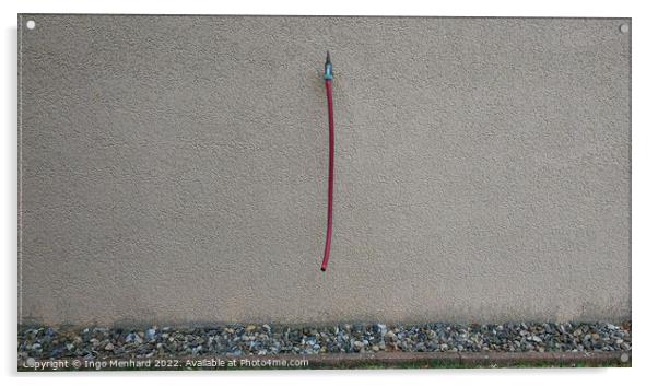 Closeup shot of a grey wall with a water tap and a hanging red hose Acrylic by Ingo Menhard