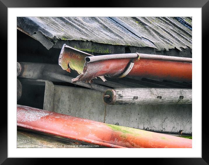 Closeup shot of a rusty pipe under the weathered roof Framed Mounted Print by Ingo Menhard