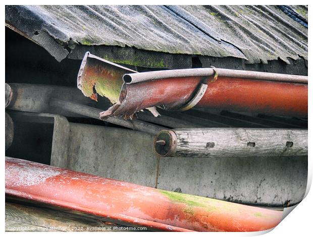 Closeup shot of a rusty pipe under the weathered roof Print by Ingo Menhard