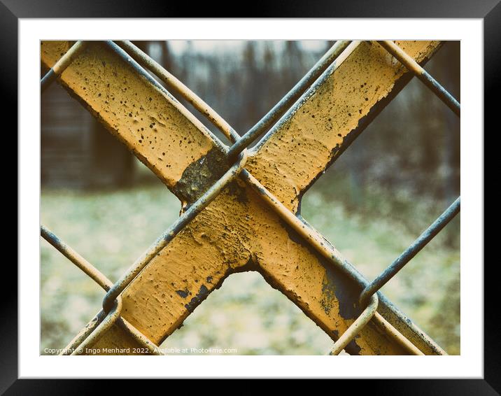 Old and weathered yellow-painted metal fence Framed Mounted Print by Ingo Menhard