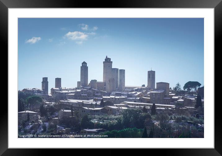 San Gimignano covered with snow. Tuscany, Framed Mounted Print by Stefano Orazzini