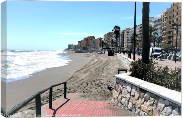 South beach and promenade on windy day, Fuengirola, Spain. Canvas Print by john hill