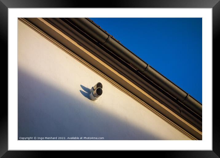 Low angle shot of a surveillance camera on a building Framed Mounted Print by Ingo Menhard