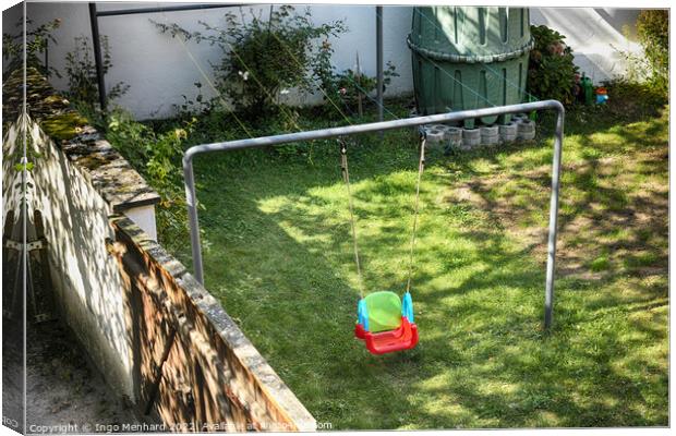 Colorful child swing in a garden Canvas Print by Ingo Menhard