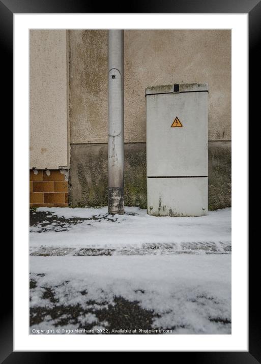 Vertical of an electricity control box on the snowy road Framed Mounted Print by Ingo Menhard