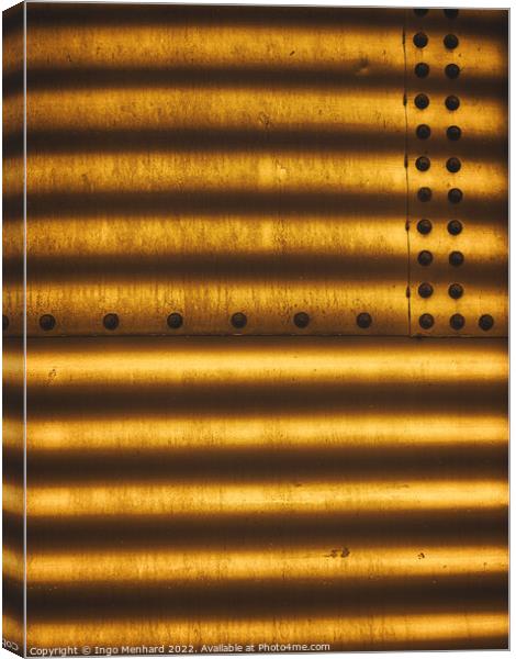 Golden metal texture with lined shadows from blinds attached with screw fasteners Canvas Print by Ingo Menhard