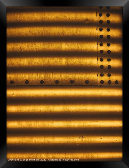 Golden metal texture with lined shadows from blinds attached with screw fasteners Framed Print by Ingo Menhard