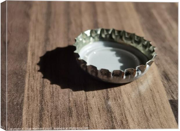 A closeup shot of a bottle cap on a wooden surface Canvas Print by Ingo Menhard