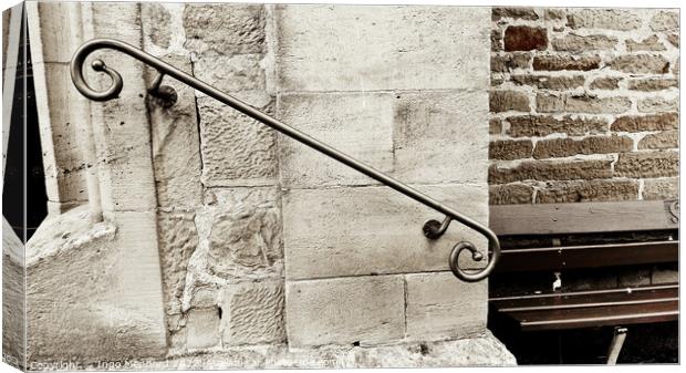 Closeup shot of a decorative metal rail on an old stone wall - perfect for background Canvas Print by Ingo Menhard