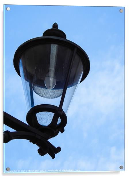 A vertical closeup shot of a street lamp against a cloudy sky Acrylic by Ingo Menhard
