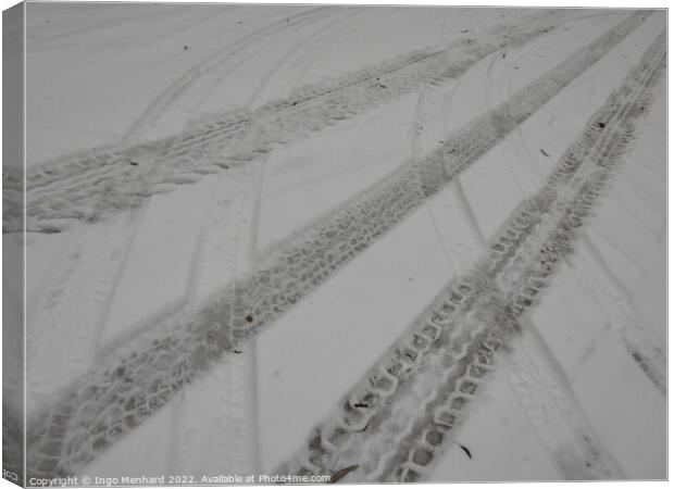 Closeup of the tire marks on the snowy road Canvas Print by Ingo Menhard