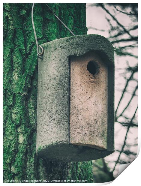 Vertical shot of a cylindrical concrete nesting box hanging from a tree Print by Ingo Menhard