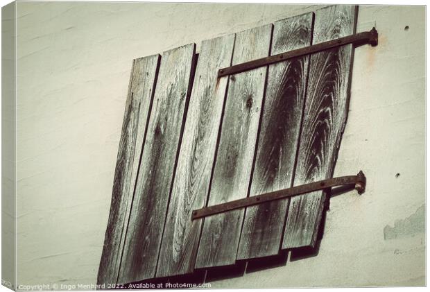 An aged wall with wooden planks Canvas Print by Ingo Menhard