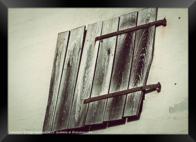 An aged wall with wooden planks Framed Print by Ingo Menhard