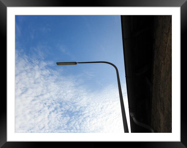 A low angle shot of a street light on a cloudy sky background Framed Mounted Print by Ingo Menhard