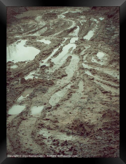 Vertical shot of mud puddles after rain Framed Print by Ingo Menhard