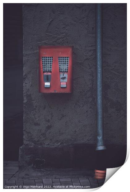 Old classic gumball machine beside a gutter Print by Ingo Menhard