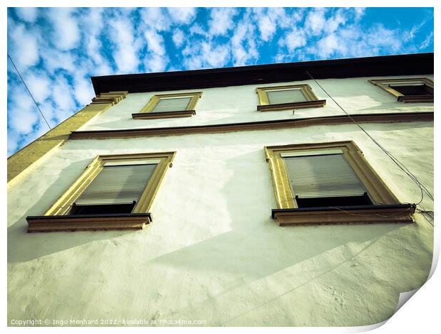 A low angle view of a building under a blue cloudy sky Print by Ingo Menhard