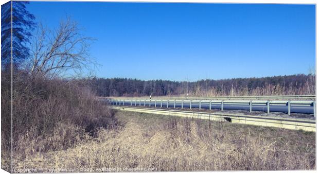Beautiful view of an empty highway road with road barriers Canvas Print by Ingo Menhard