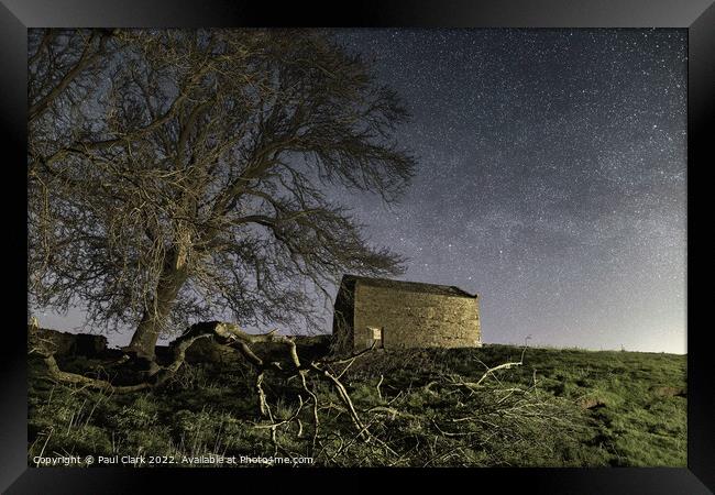 Swaledale barn and trees under the stars Framed Print by Paul Clark