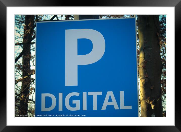 Closeup shot of a blue and white parking sign on a blurred background Framed Mounted Print by Ingo Menhard