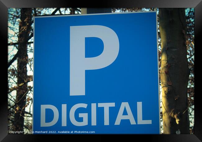 Closeup shot of a blue and white parking sign on a blurred background Framed Print by Ingo Menhard